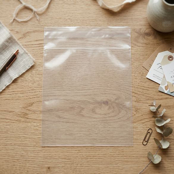 Plastpåsar 24x33,5cm Transparent med Tejpremsa (100 st) [B913]